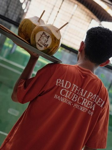 Club crew serving coconuts, Bali